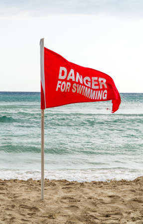Danger for swimming red flag on the beach.の写真素材