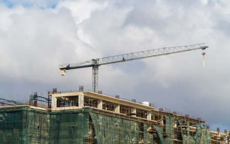 Industrial construction crane in the city.の写真素材