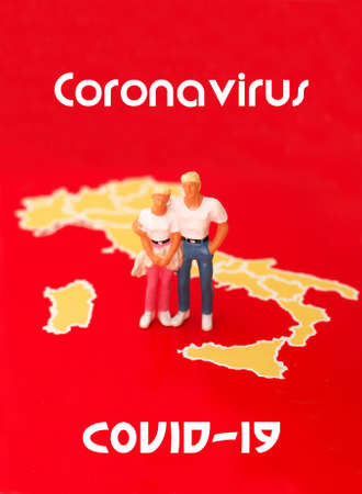 Figures of the couple on a map of Italy.の写真素材