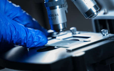 Close-up shot of Laboratory microscope with sample glass.の写真素材