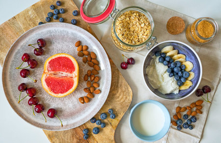 Healthy breakfast with berries, yogurt and oat flakes.