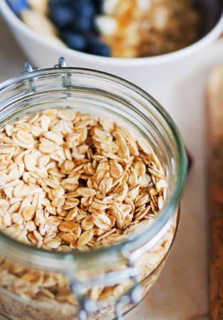 Oat flakes in the glass jar. Close-up view.の写真素材