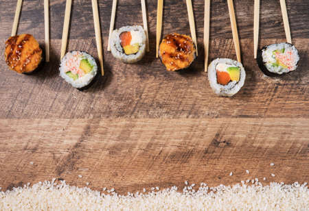 Sushi roll set with chopsticks. Place for your text or logo.の写真素材
