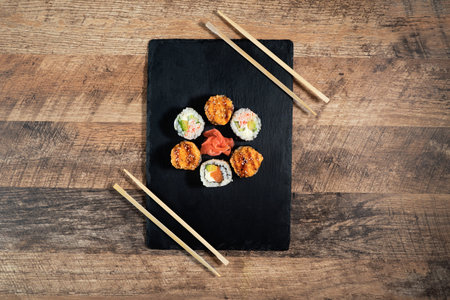 Sushi roll set on the black plate. Japanese food.の写真素材