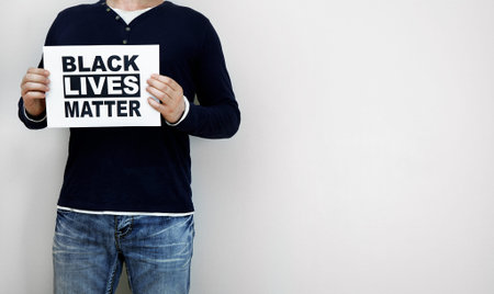 Man holding Black lives matter sign.