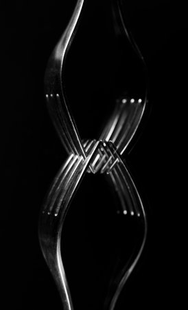 Composition made of forks on the black background.