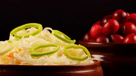 Sauerkraut with cranberries in a pot.の写真素材