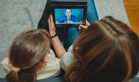 Family making video call with their doctor.
