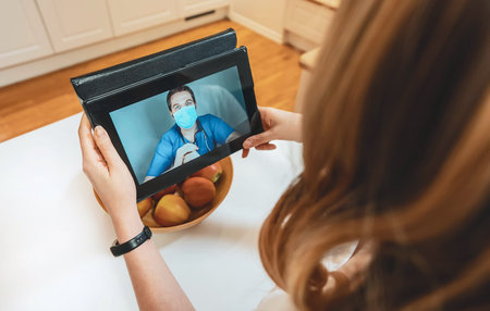 Woman making video call with her doctor.