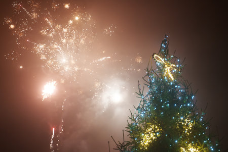 People celebrating new year with fireworks in the city.の写真素材