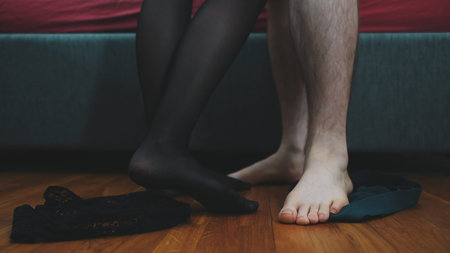 Man and woman takes off their clothes. Love concept.