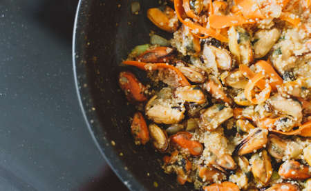 Cooking of traditional Moroccan couscous with mussels.の写真素材