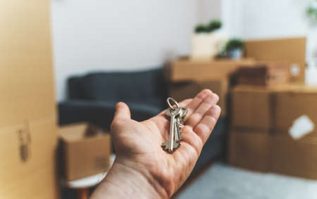 Hand with house key. Real estate and moving concept.の写真素材