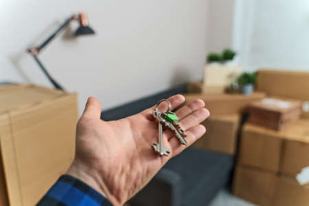 Hand with house key. Real estate and moving concept.の写真素材