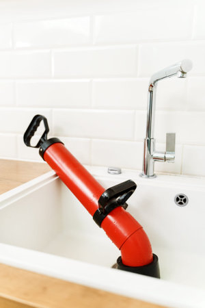 Professional force pump cleaner in the kitchen sink.
