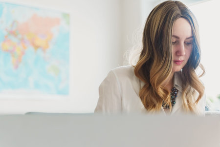 Travel agent working with documents at office.