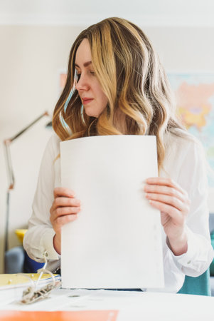 Travel agent working with documents at office.の写真素材