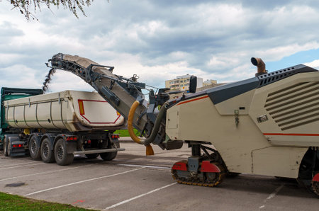 Asphalt milling machine working on the street. Pavement milling.