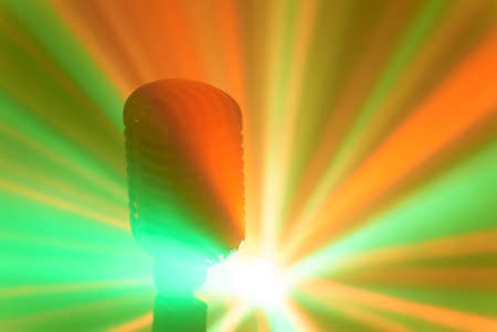 Vintage microphone with stage disco lights. Live performance or karaoke concept.の写真素材
