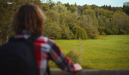 Male tourist with backpack enjoying the nature.の写真素材