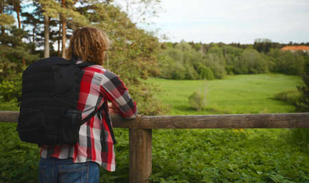 Male tourist with backpack enjoying the nature.の写真素材
