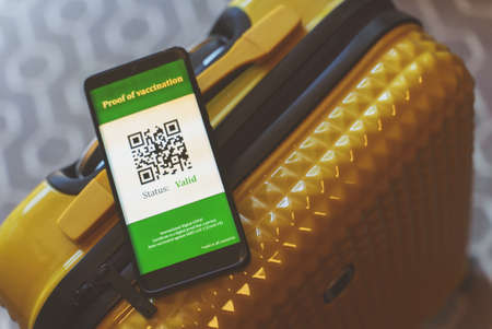 virus vaccine passport app on smartphone. Status is valid.の写真素材