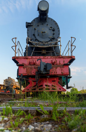 Old rusty steam locomotive in open air museum.