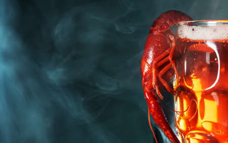 Boiled crawfish crawfish hanging on beer glass.の写真素材