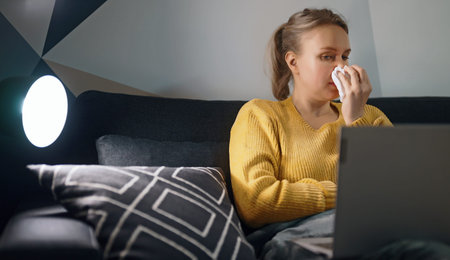Sick woman trying to work from home.
