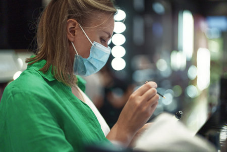 Woman trying cosmetics products in the cosmetics store.