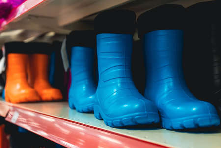 Collection of rubber boots in a clothing store.の写真素材