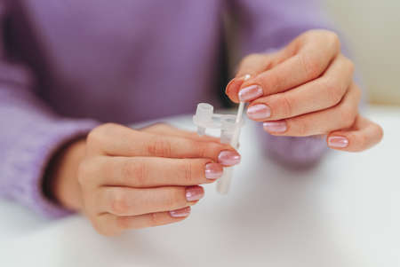 Teenager doing express antigen test.の写真素材