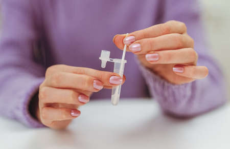 Teenager doing express antigen test.の写真素材