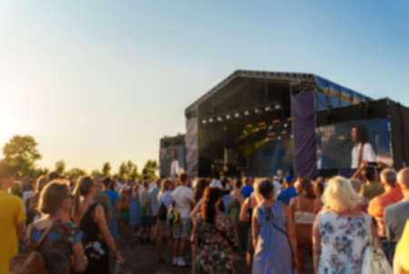 Musical band performing live on the stage. Blurred image.の写真素材