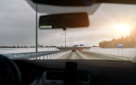 Difficult weather conditions on the road. Snow Plows clear the track.の写真素材