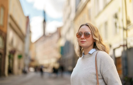 Female tourist in sunglasses in old Tallinn.の写真素材