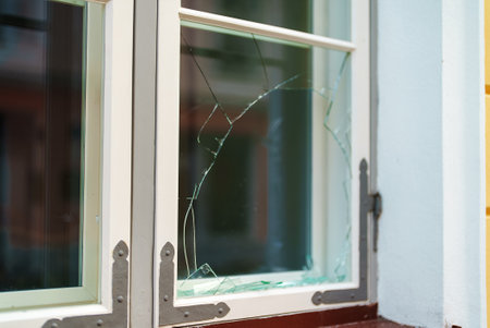 Broken window in the house. Vandalism and pogroms.の写真素材