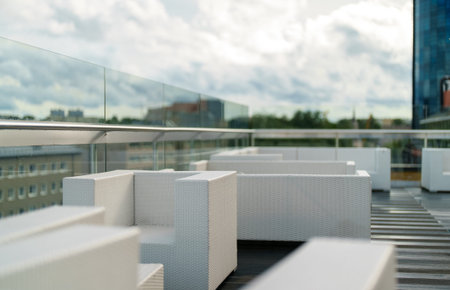 Rooftop cafe interior with table and chairs.