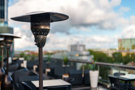 Stainless stand up outdoor gas heater in cafe.の写真素材