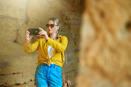 Woman visiting Tombs of the Kings in Paphos.