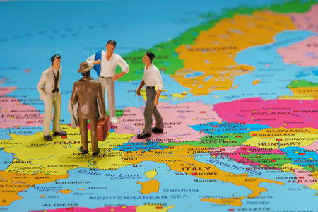 Business people meeting concept. Figurines of men on the map of Europe.