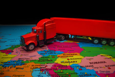 Red truck with trailer on the Europe map.の写真素材