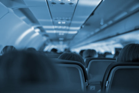 Interior inside of the plane with passengers.