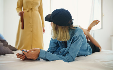 Mother lecture with teenage daughter over use of smartphone.の写真素材