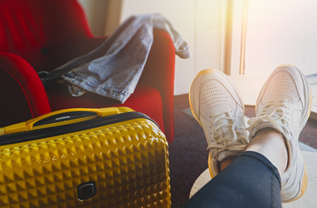 Woman is waiting to board a plane in the VIP zone.の写真素材