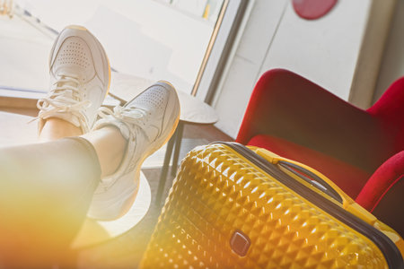 Woman is waiting to board a plane in the VIP zone.