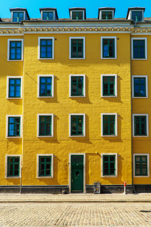 Yellow and white concrete building in Copenhagen, Denmark.