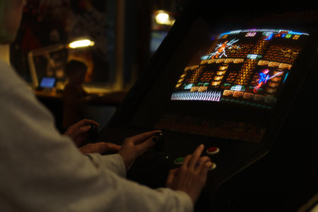Tallinn, Estonia - 21.05.2022: LVLup! Video Game Museum - People playing video gameのeditorial素材
