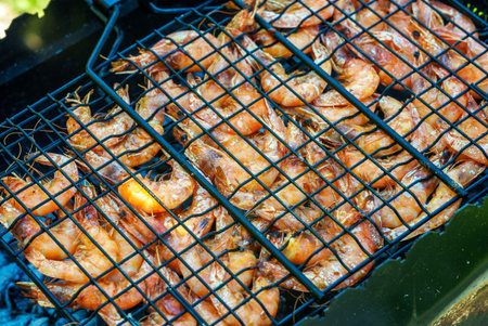 Fresh shrimps is cooked on the fire.