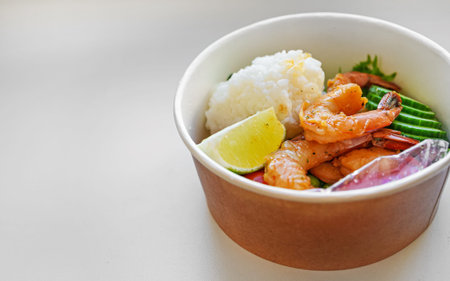 Store-bought poke bowl with shrimp and rice.